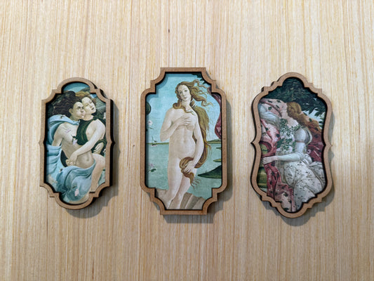 Three classical-style paintings on a wooden panel